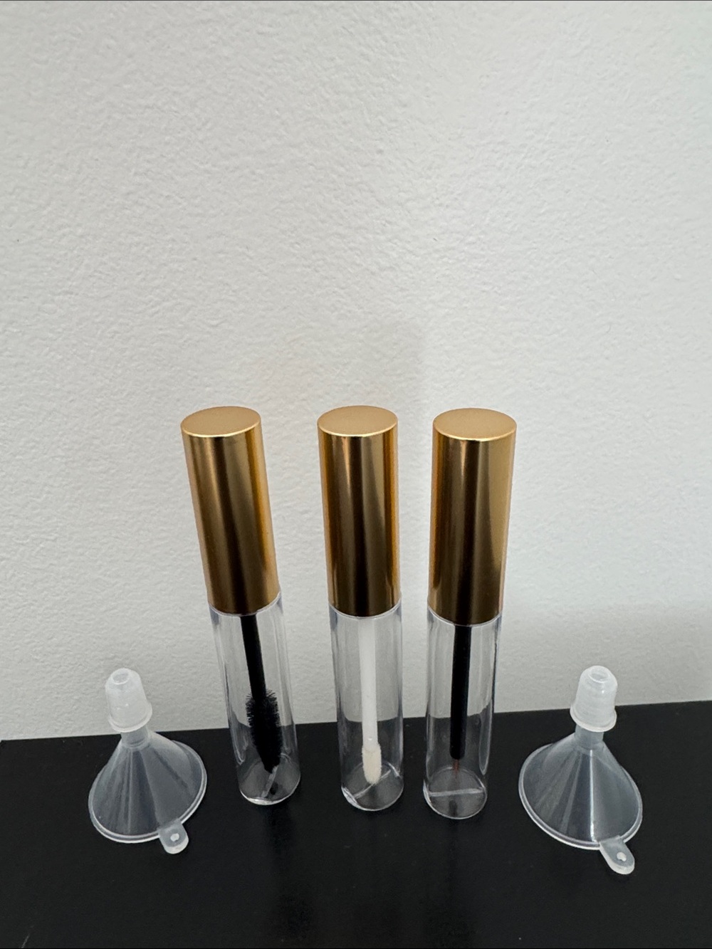 Set of 3 tubes mascara, liner and gloss with two funnels New
